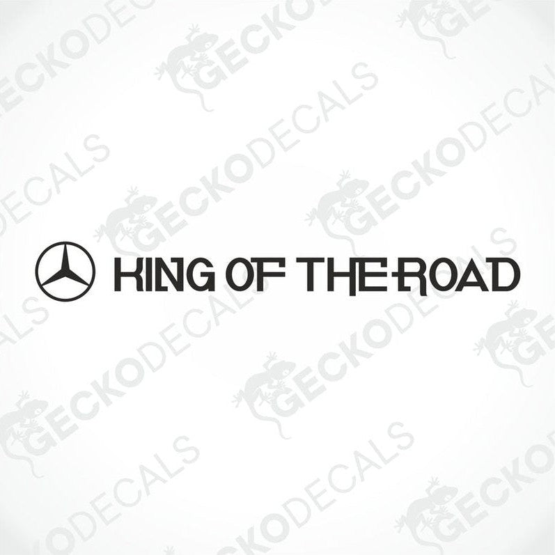 A die cut decal with the text 'K I N G O F T H E R O A D' printed on it, positioned on the front of a gray truck.