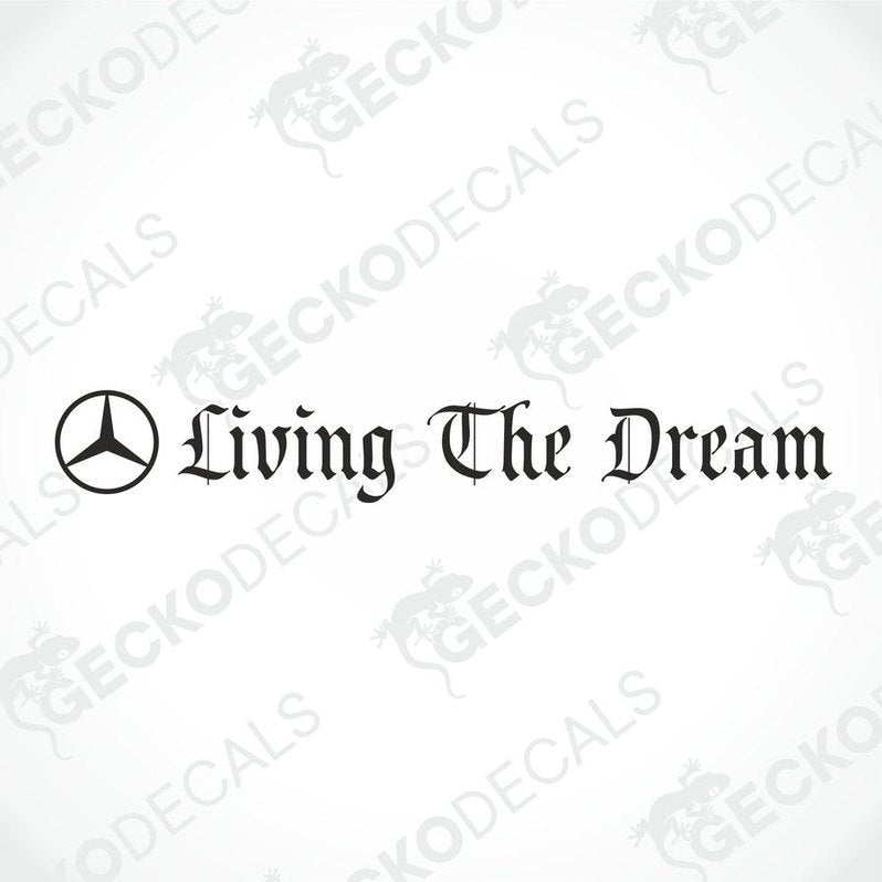 A sticker with the text 'Living The Dream' placed on the windscreen of a gray Mercedes-Benz truck.