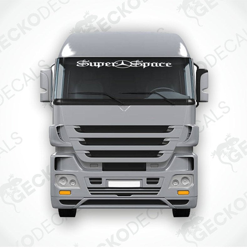 A die cut decal with the text 'Super Space' displayed on the front of a truck windshield.
