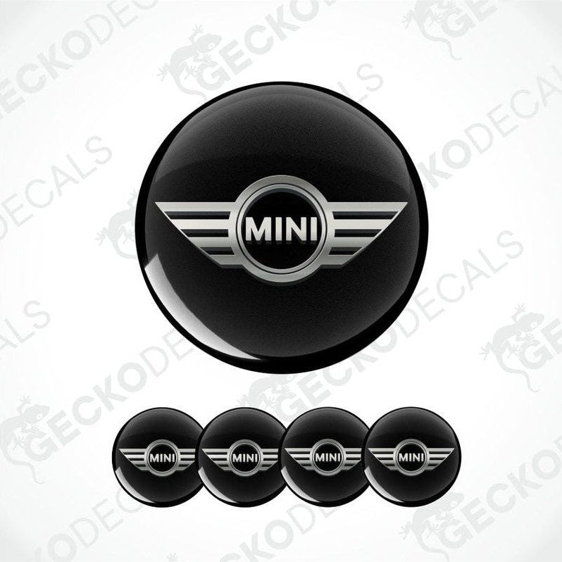 Set of black MINI car logo stickers on a white background