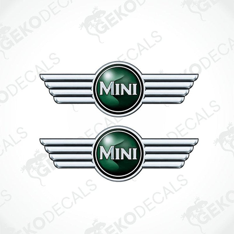 Two vinyl stickers with a MINI COOPER branding, featuring a green and silver emblem design.