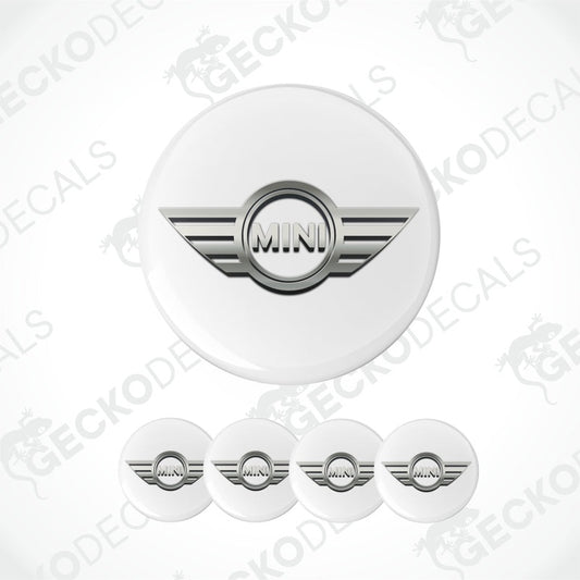 Set of white circular stickers with a silver 'MINI' logo on a white background.