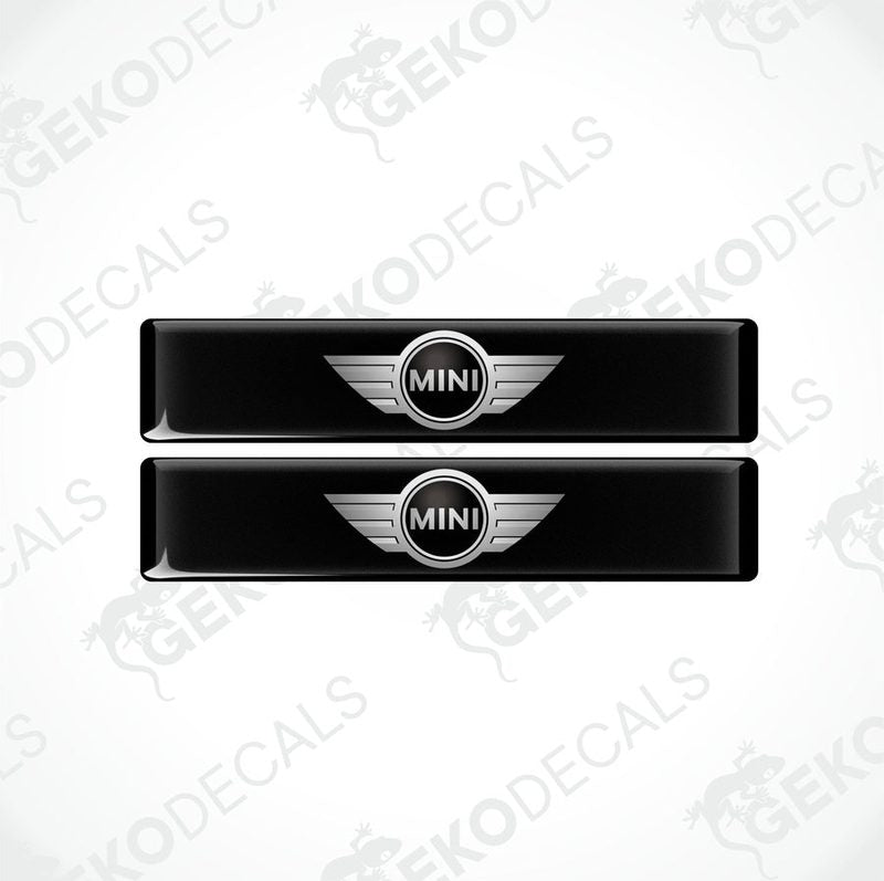 Two black, silver, and white vinyl decals with the Mini Cooper logo