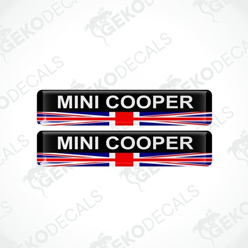 A set of two vinyl stickers with a MINI COOPER branding and a design resembling the British flag in red, white, and blue.