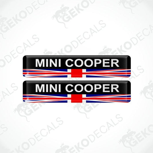 A set of two vinyl stickers with a MINI COOPER branding and a design resembling the British flag in red, white, and blue.
