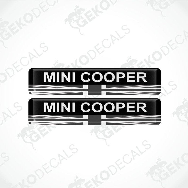 Two black, white, and red vinyl decals with the text 'MINI COOPER' on them.
