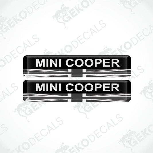 Two black, white, and red vinyl decals with the text 'MINI COOPER' on them.
