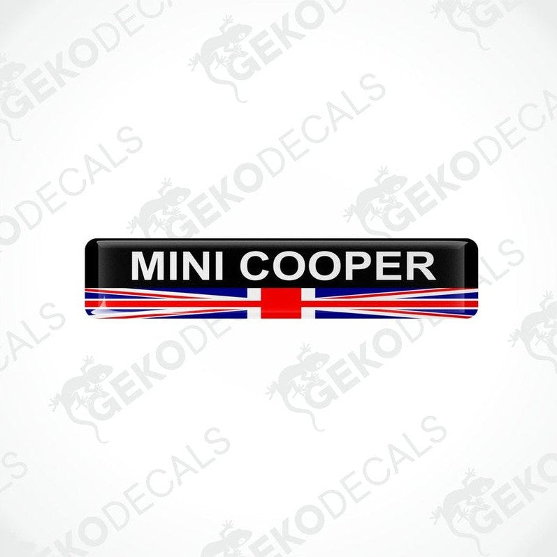 Vinyl stickers with a MINI COOPER branding and a design resembling the British flag in red, white, and blue.