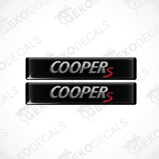 Two black vinyl decals with 'COOPERS' text in white and red, designed for use as car stickers.