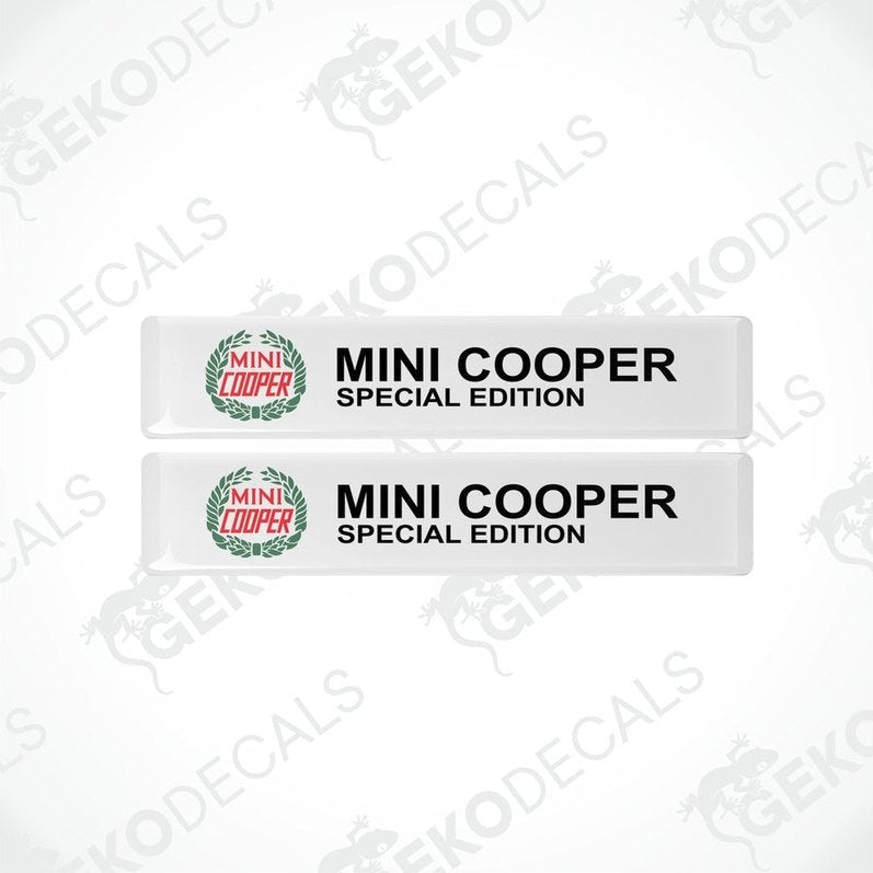Two white, green,red and black vinyl decals with the Mini Cooper Special edition logo