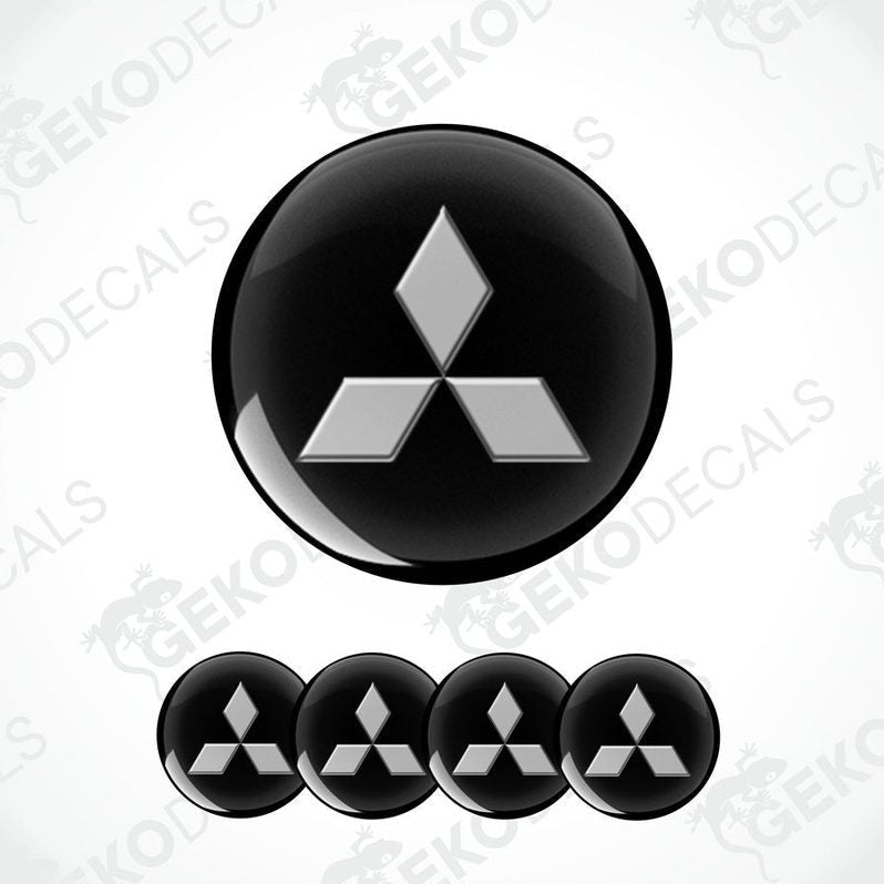 A set of black Mitsubishi car decals, with one large decal featuring the Mitsubishi logo and four smaller ones without the logo.