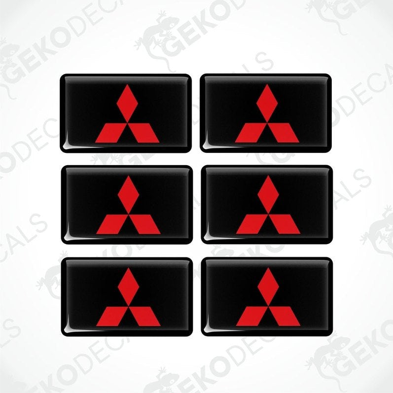 A set of six black vinyl stickers with a red Mitsubishi logo on each.