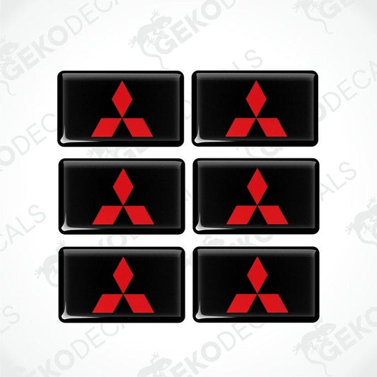 A set of six black vinyl stickers with a red Mitsubishi logo on each.