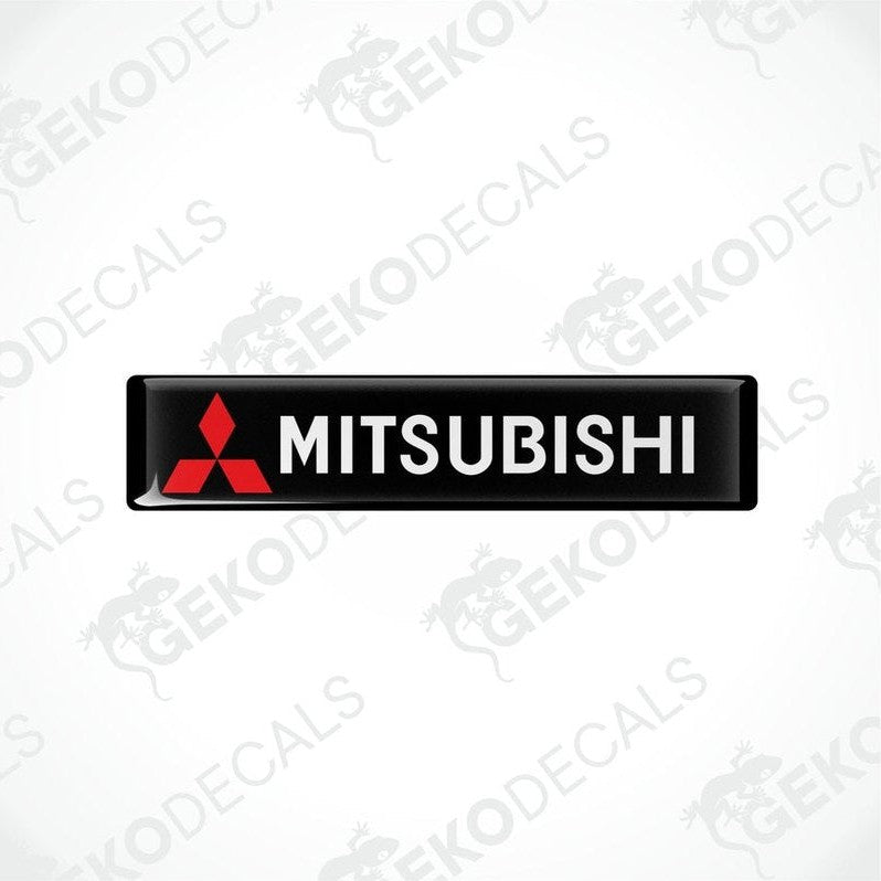 Rectangular black vinyl decals with the Mitsubishi logo in red and white.
