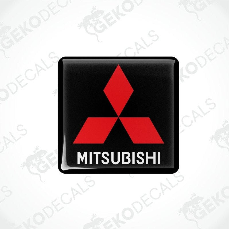 Black vinyl stickers with a red Mitsubishi logo on each, placed against a white background with the text 'MITSUBISHI' below each sticker.