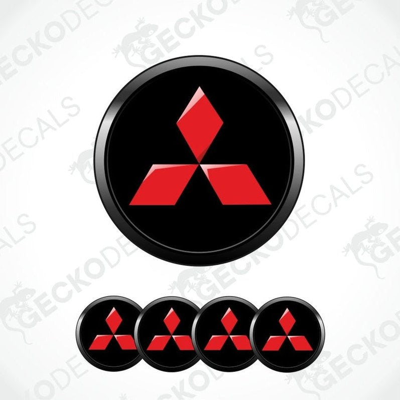 Red Mitsubishi logo on black circular stickers with a white background.