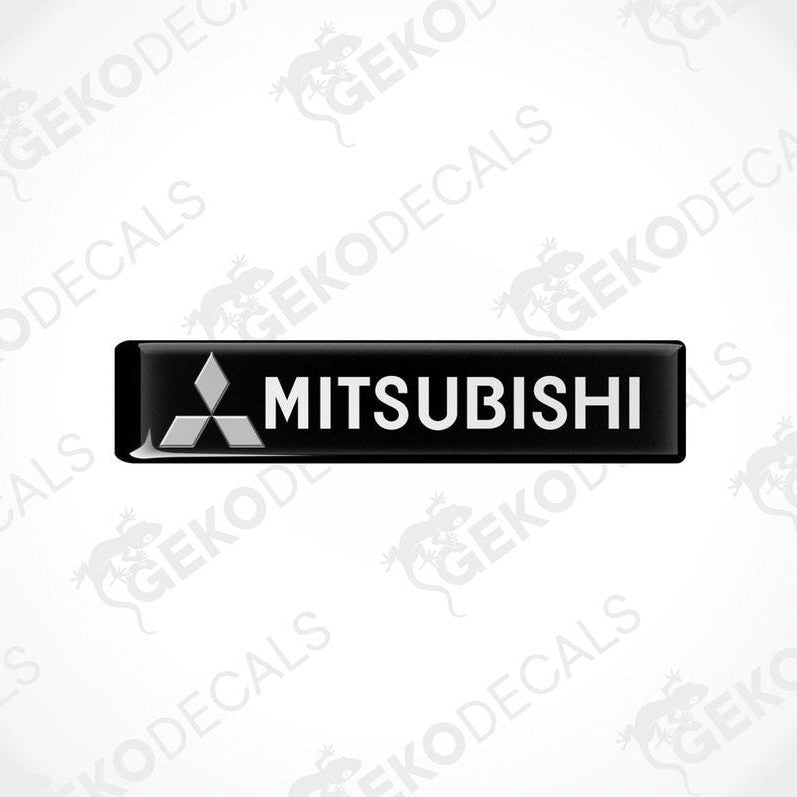  Black vinyl stickers with the Mitsubishi brand logo on them.