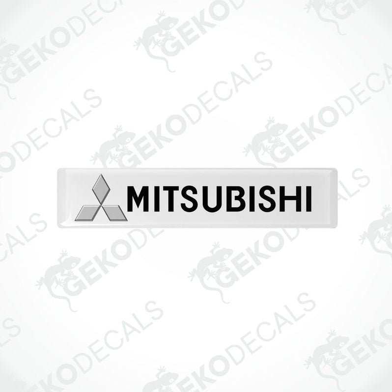  White vinyl stickers with the Mitsubishi brand logo on them.