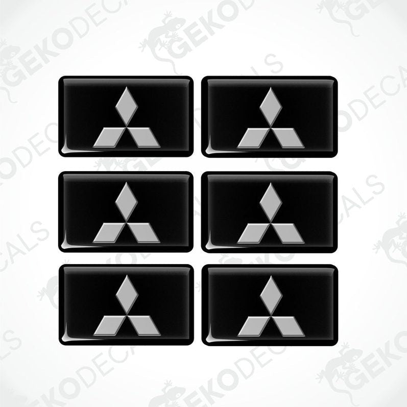 A set of six black vinyl stickers with a three-dimensional Mitsubishi logo design.