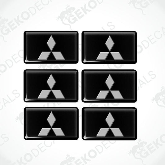 A set of six black vinyl stickers with a three-dimensional Mitsubishi logo design.
