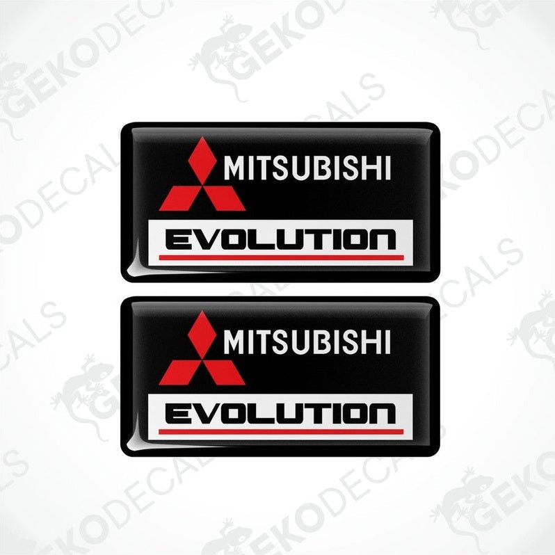 Two black vinyl stickers with red and white Mitsubishi Evolution branding.