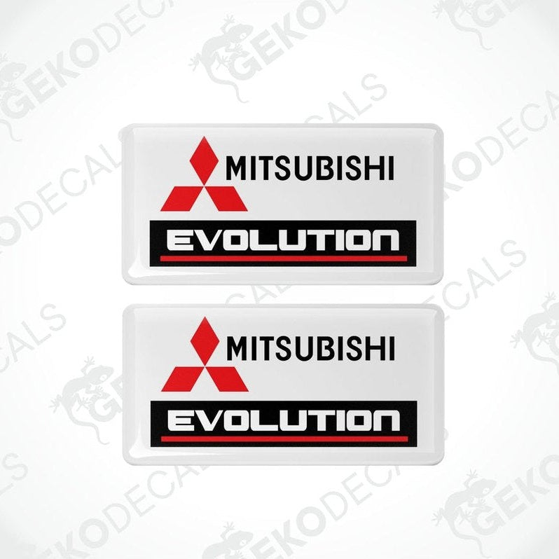 Two white vinyl stickers with red and black Mitsubishi Evolution branding.