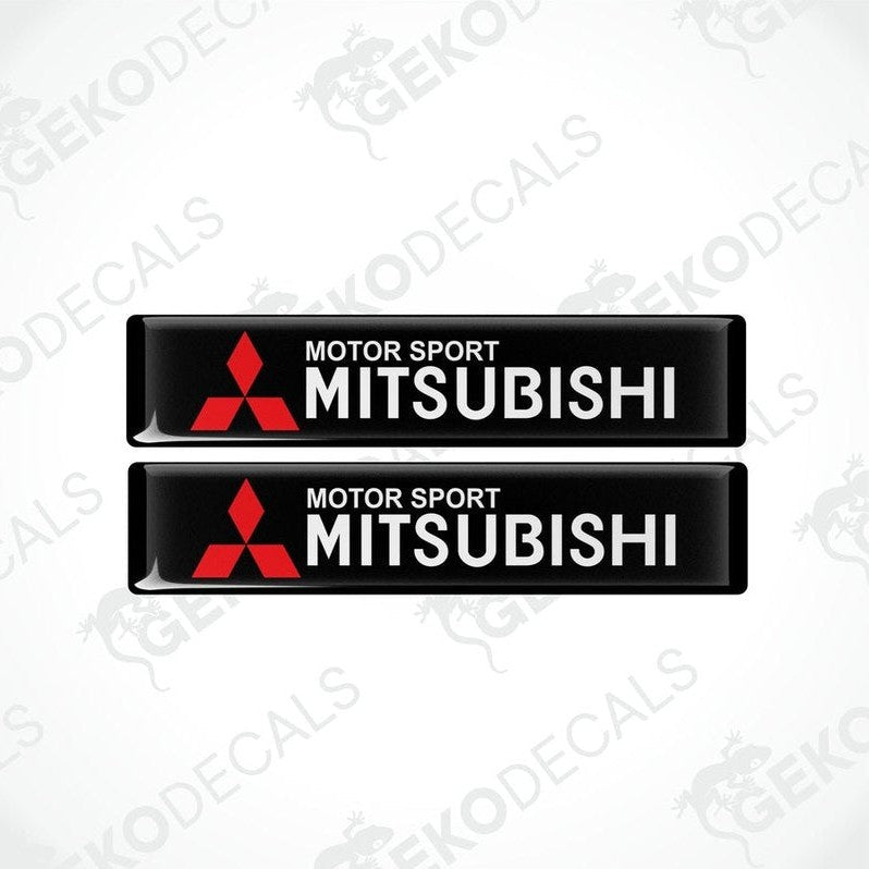 Two black vinyl decals with the red 'MOTOR SPORT MITSUBISHI' text and logo.