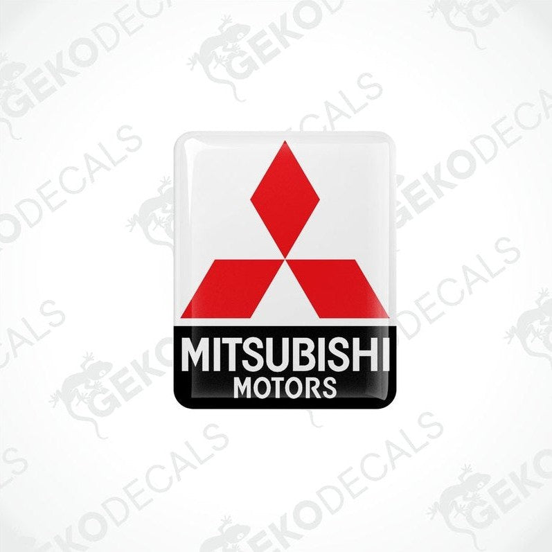 Square-shaped decals with the Mitsubishi Motors logo in red and black on a white background.