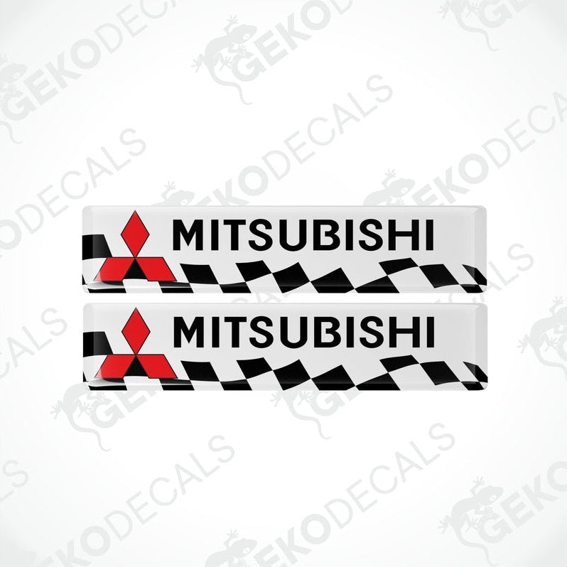 Two vinyl decals with polyurethane coating featuring the Mitsubishi logo in white, red, and black colors.