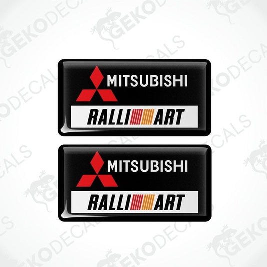 Two black vinyl stickers with the Mitsubishi Ralliart logo in orange and white.