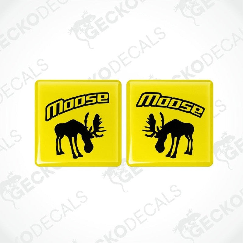 Two yellow square vinyl decals with the silhouette of a moose and the text 'VOLVO MOOSE' below it.