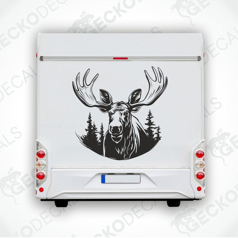 A die cut decal of a moose with a forest background, intended for use on vehicles or other surfaces, delivered on transfer paper.