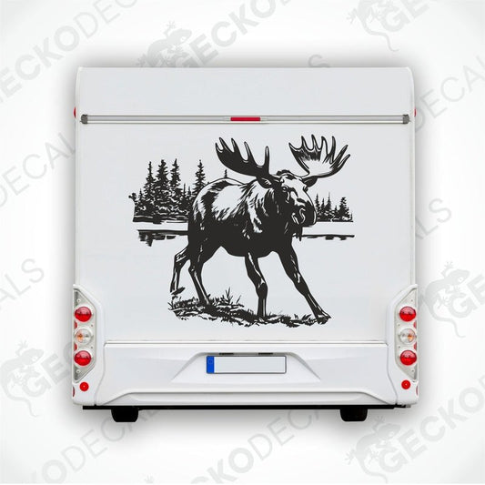 A decal of a moose on the side of a white vehicle, with a forest and lake in the background.