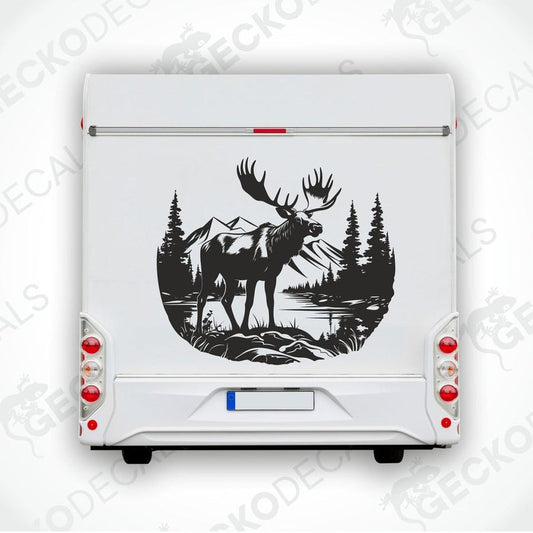 A decal of a moose in a forest and mountain setting, intended for use on a vehicle.