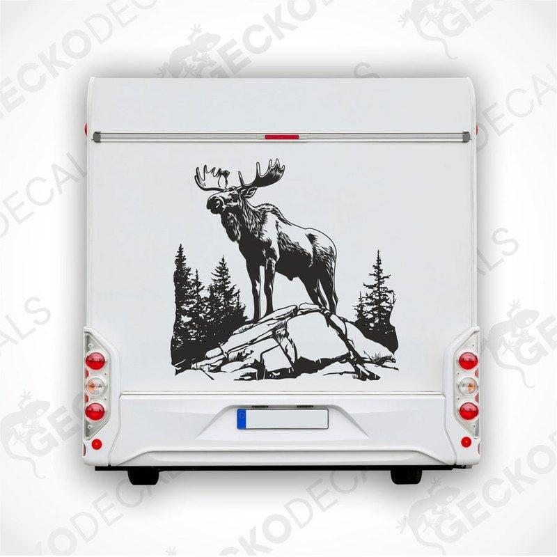 A decal of a moose in a forest and mountain setting, intended for use on a vehicle.