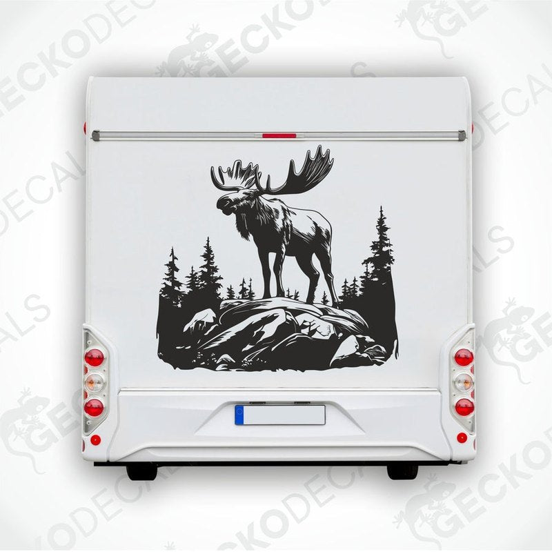 A decal of a moose in a forest and mountain setting, intended for use on a car or other vehicle.