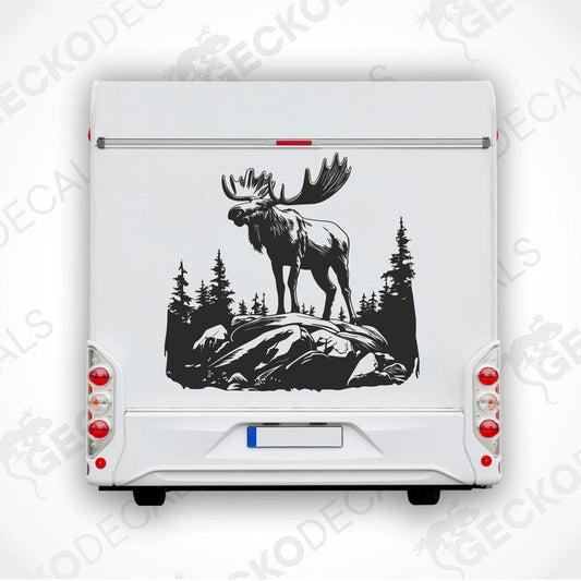 A decal of a moose in a forest and mountain setting, intended for use on a car or other vehicle.