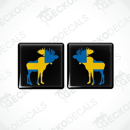 Two square car decals featuring a moose silhouette in blue and yellow on a black background.