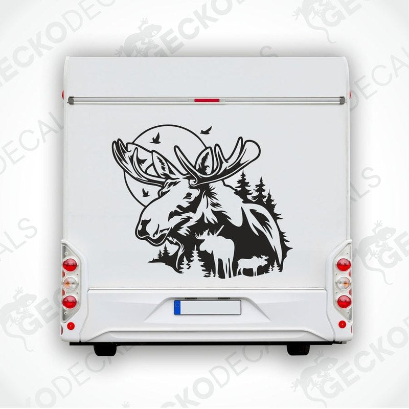 A die cut decal of a moose in a nature setting, with trees and a moon, intended for use on vehicles or equipment.