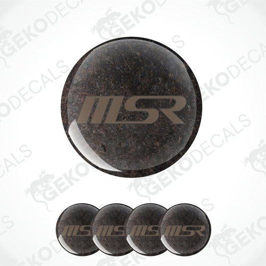 A set of four brown vinyl stickers with a brown 'MSR' logo, designed for car rim stickers.