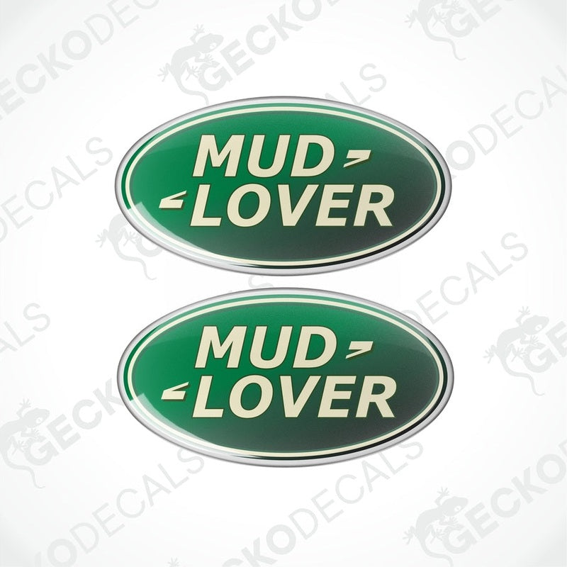 Two green oval-shaped vinyl decals with the text 'MUD LOVER' in white and silver.