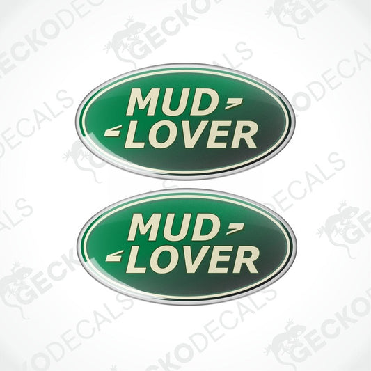 Two green oval-shaped vinyl decals with the text 'MUD LOVER' in white and silver.