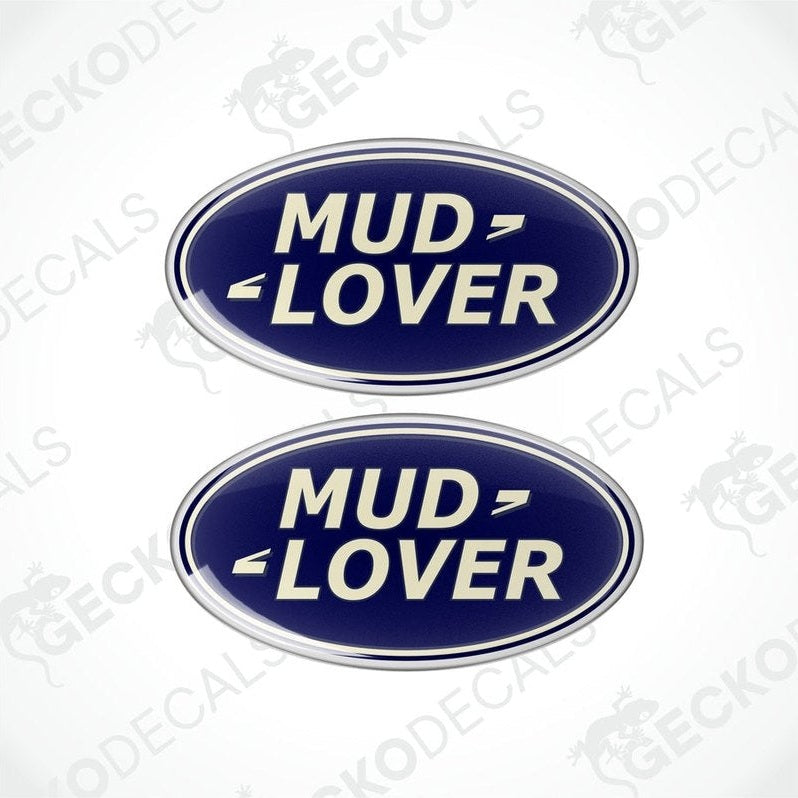 Two blue oval-shaped vinyl decals with the text 'MUD LOVER' in white and silver.