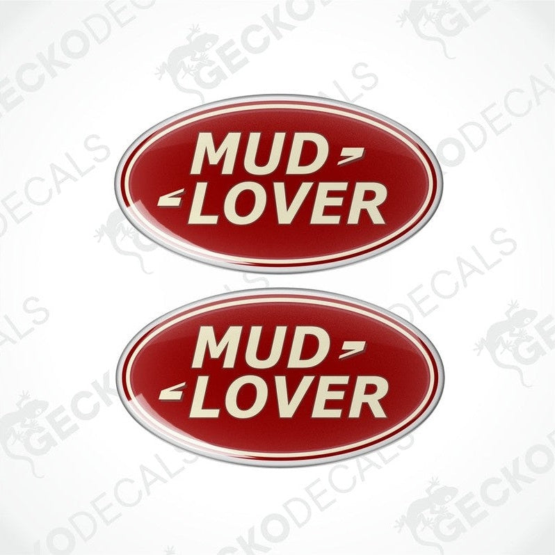 Two red oval-shaped vinyl decals with the text 'MUD LOVER' in white and silver.