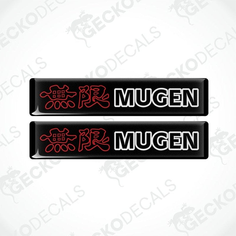 Two black vinyl stickers with red and white text and graphics, including the word 'MUGEN'.