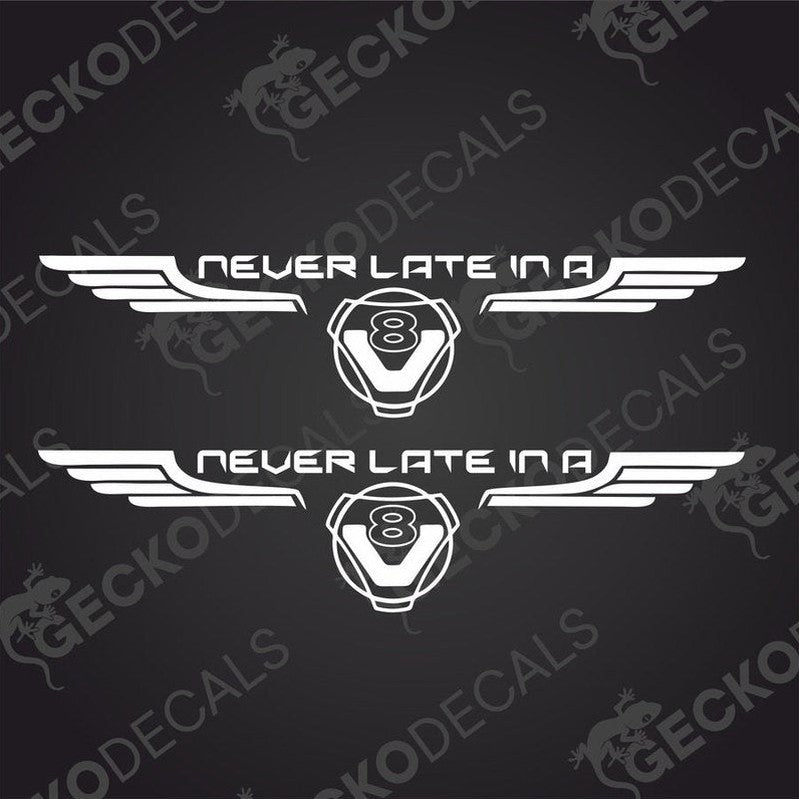 Two white decals with 'NEVER LATE IN A' and 'SCANIA V8' text, with a graphical design in the middle, delivered on transfer paper.