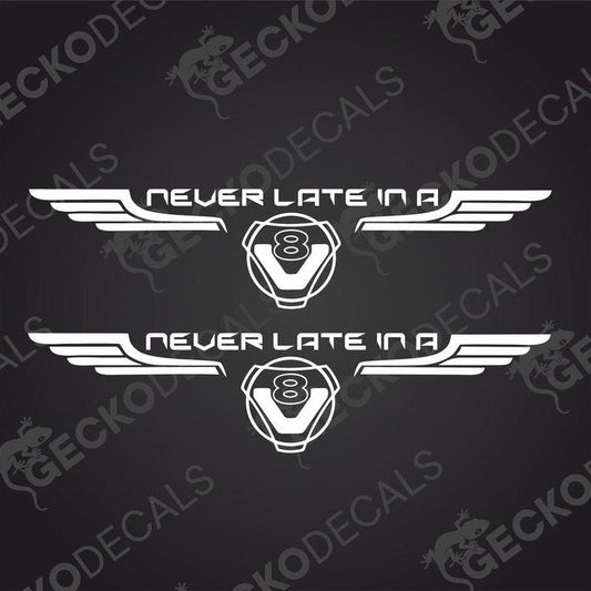 Two white decals with 'NEVER LATE IN A' and 'SCANIA V8' text, with a graphical design in the middle, delivered on transfer paper.