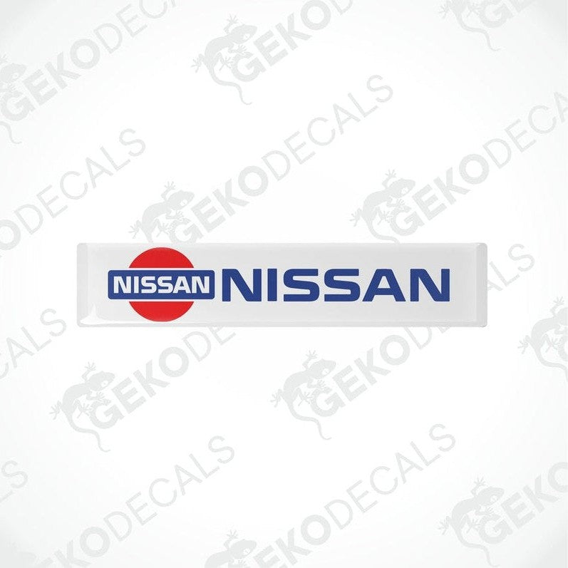 Vinyl decals with polyurethane coating featuring the NISSAN logo, predominantly red and white in color.