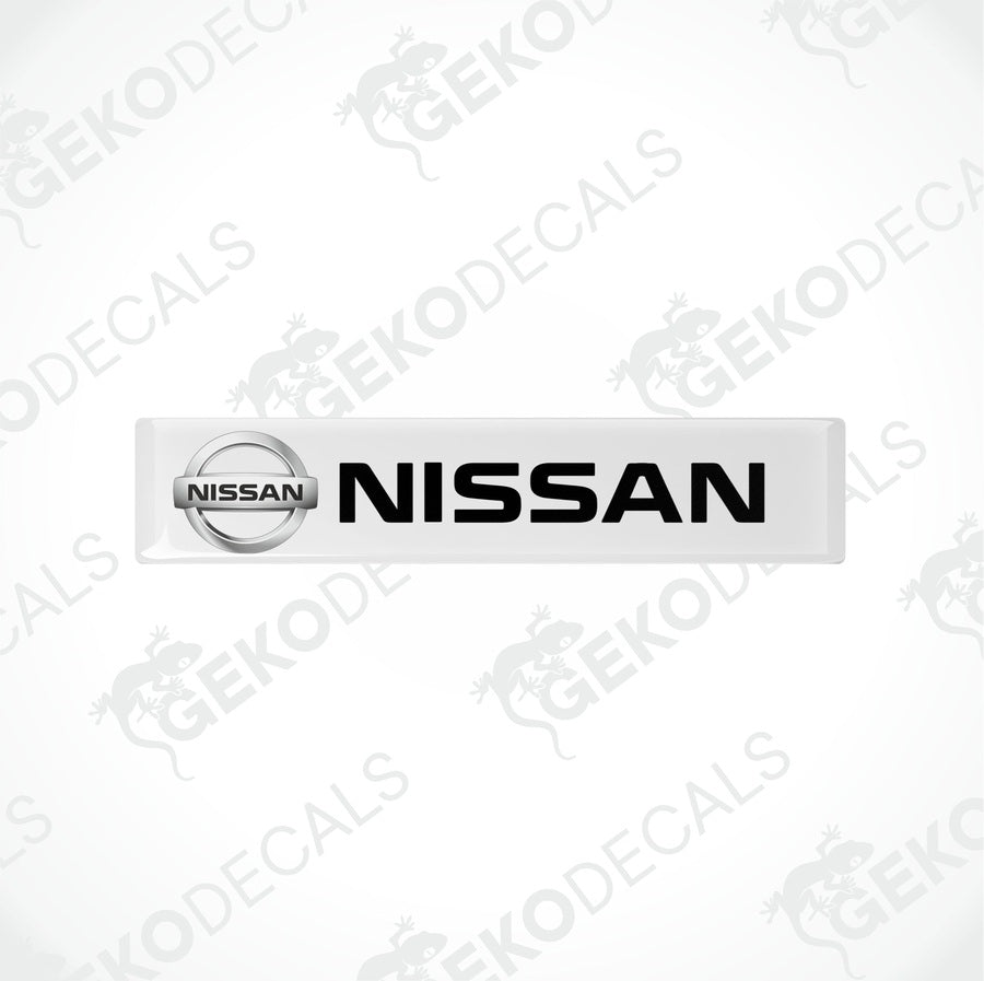 Rectangular withe vinyl decals with the black text 'NISSAN' on them, placed on a white background.