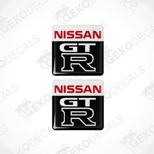 Two nissan gt r vinyl stickers with a white, red, black, and gray color scheme.